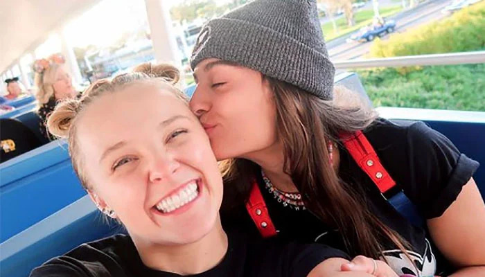 Jojo Siwa and Avery Cyrus kissing