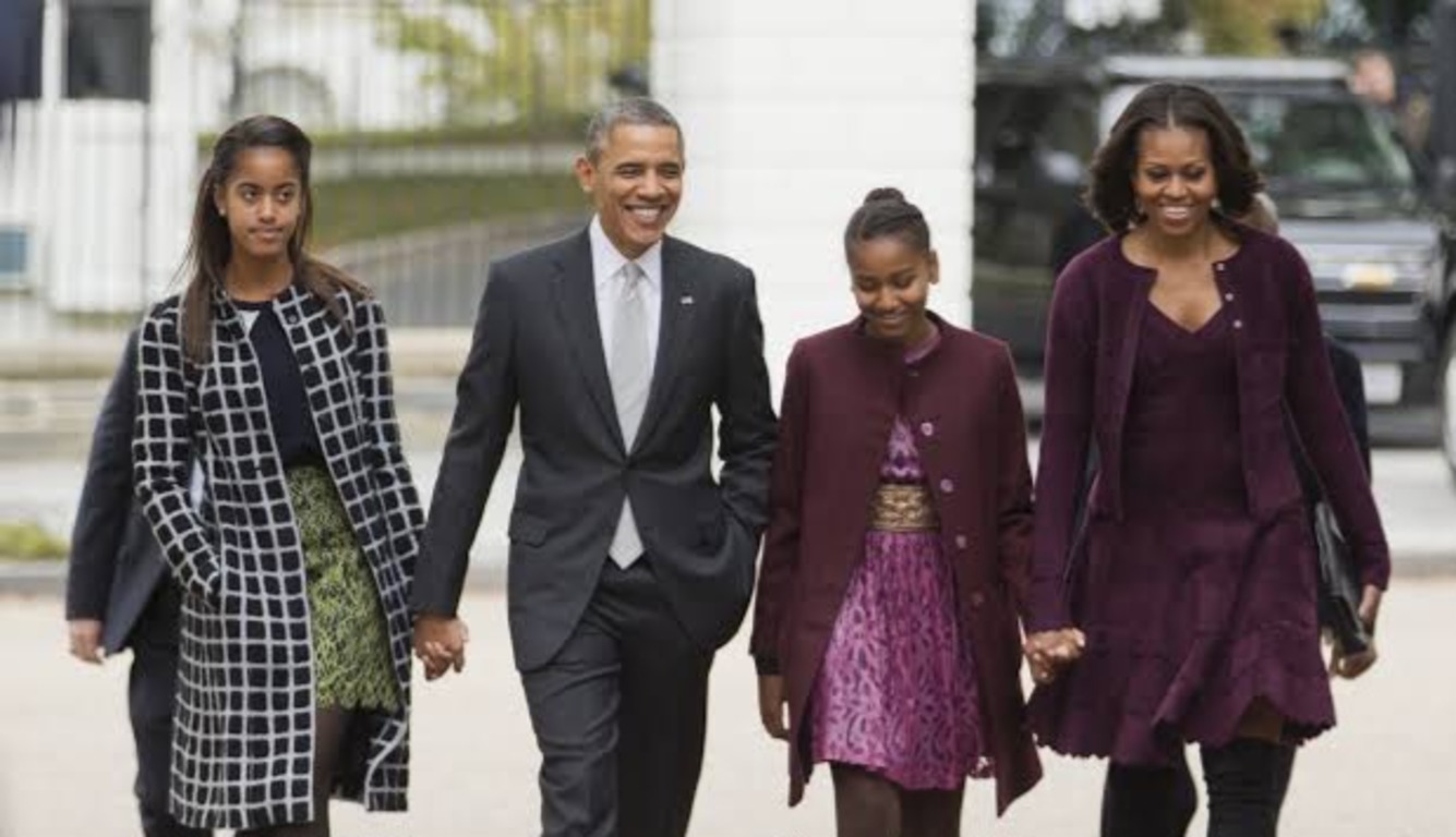 Michelle Obama with Barack Obama and her kids