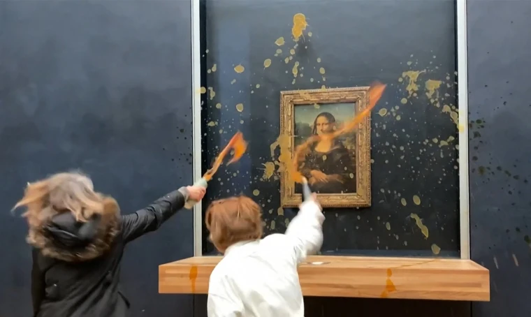 Demonstrators Take Aim at the Mona Lisa, Using Soup to Make a Statement. Here's the Motivation.