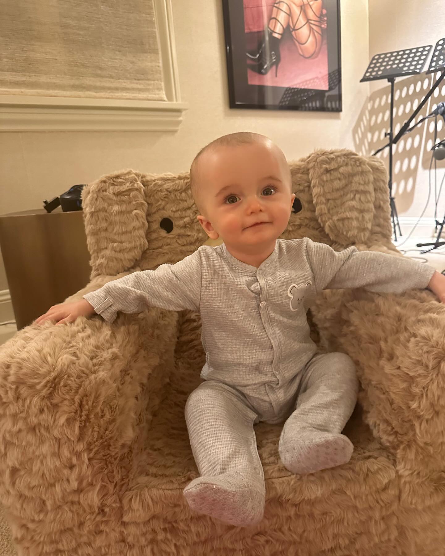 Paris Hilton's son Phoenix poses on chair