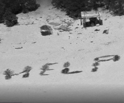 Stranded on island, men spell ‘HELP’ with palm fronds