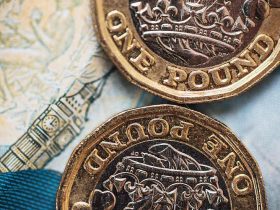 Pound Sterling edges lower to 1.2450