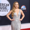 Hilary Duff wearing shimmering silver gown on the red carpet at the 2026 American Music Awards in Las Vegas