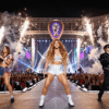 Shakira, Madonna, and BTS performing together on stage during the historic 2026 FIFA World Cup Final halftime show at the New York New Jersey Stadium, with dazzling lights, pyrotechnics, and massive global audience